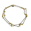 Beads of faceted Black Onyx interwoven with beads and charms of gold. Can easily be worn in 2 layers. A dramatic layering necklace that can be work for any occasion. Metal used is 22 carat Vermeil over Sterling Silver.