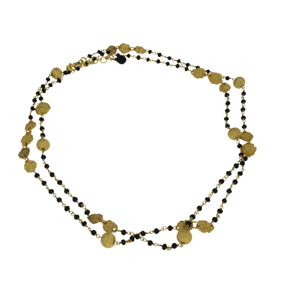 Beads of faceted Black Onyx interwoven with beads and charms of gold. Can easily be worn in 2 layers. A dramatic layering necklace that can be work for any occasion. Metal used is 22 carat Vermeil over Sterling Silver.