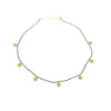 A delicate short necklace 16"-18" long in faceted Iolite beads punctuated with hammered gold discs at intervals. Metal used is 22 carat Vermeil over Sterling Silver.